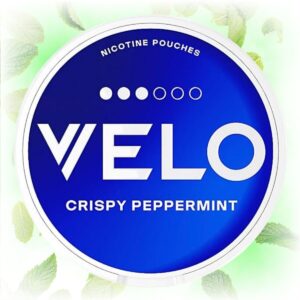 Velo Crispy Peppermint Mini nicotine pouches in a mint blue tin with peppermint leaves in the background.